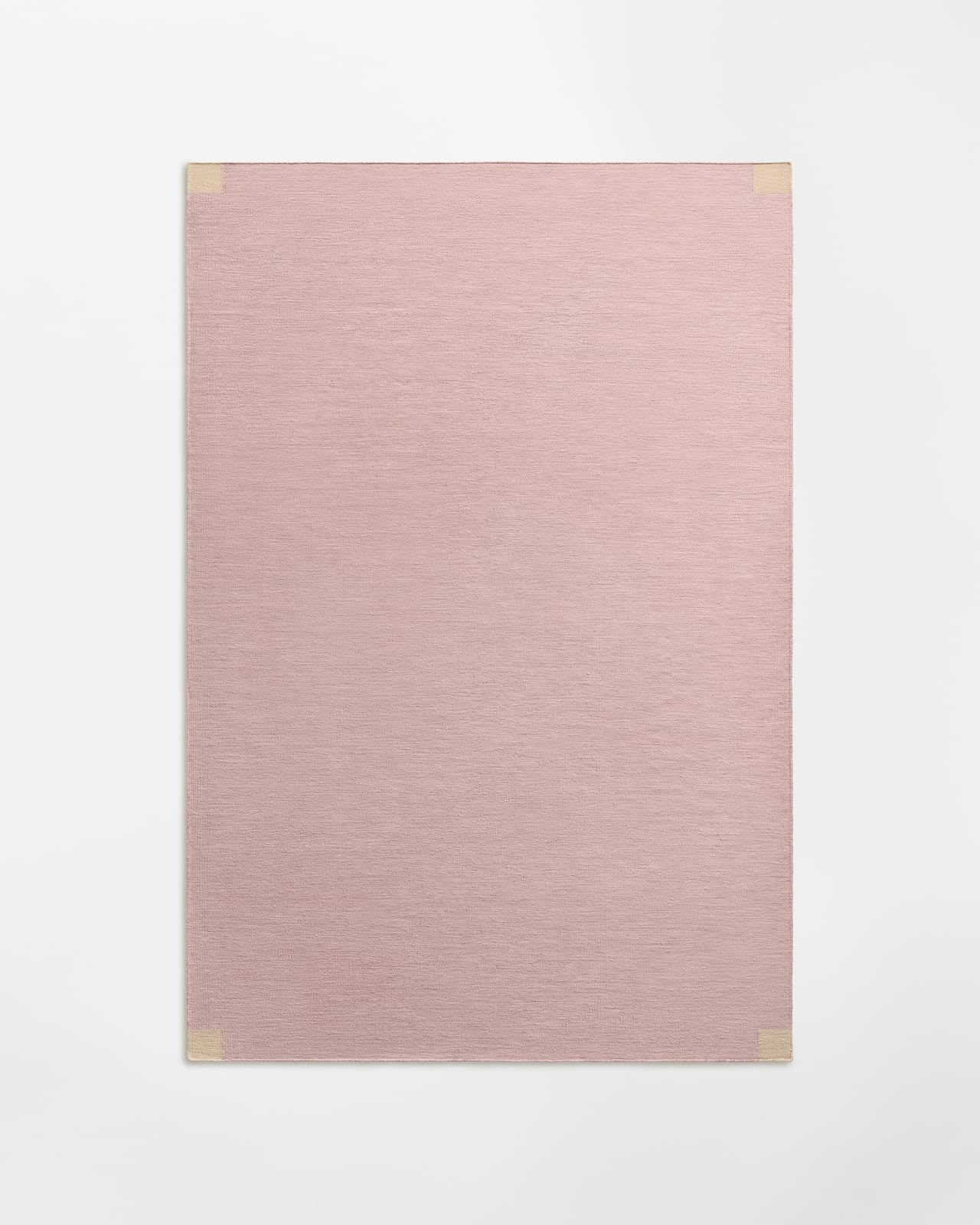 Tradition Solid - Pink rug in a muted pink with a melanged flatweave texture and contrasting tonal corner accents.
