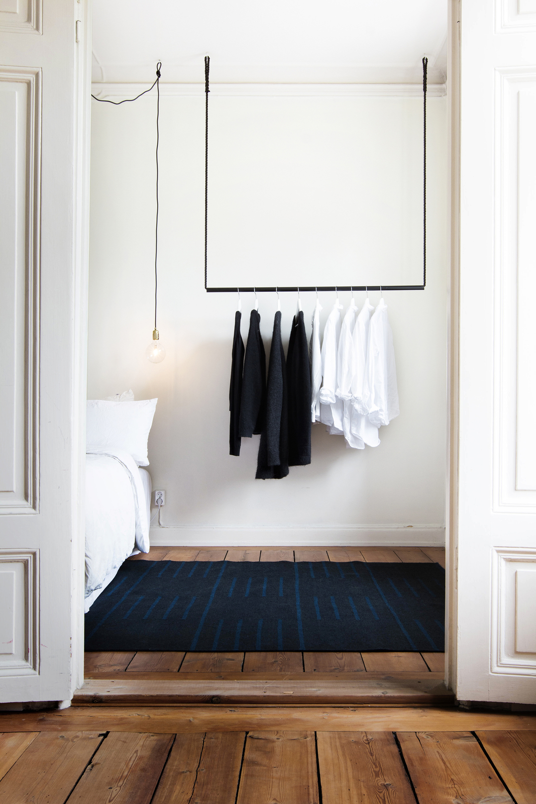 Classic - Black/Teal flatweave rug featuring a geometric pattern of horizontal teal lines on a deep black base.
